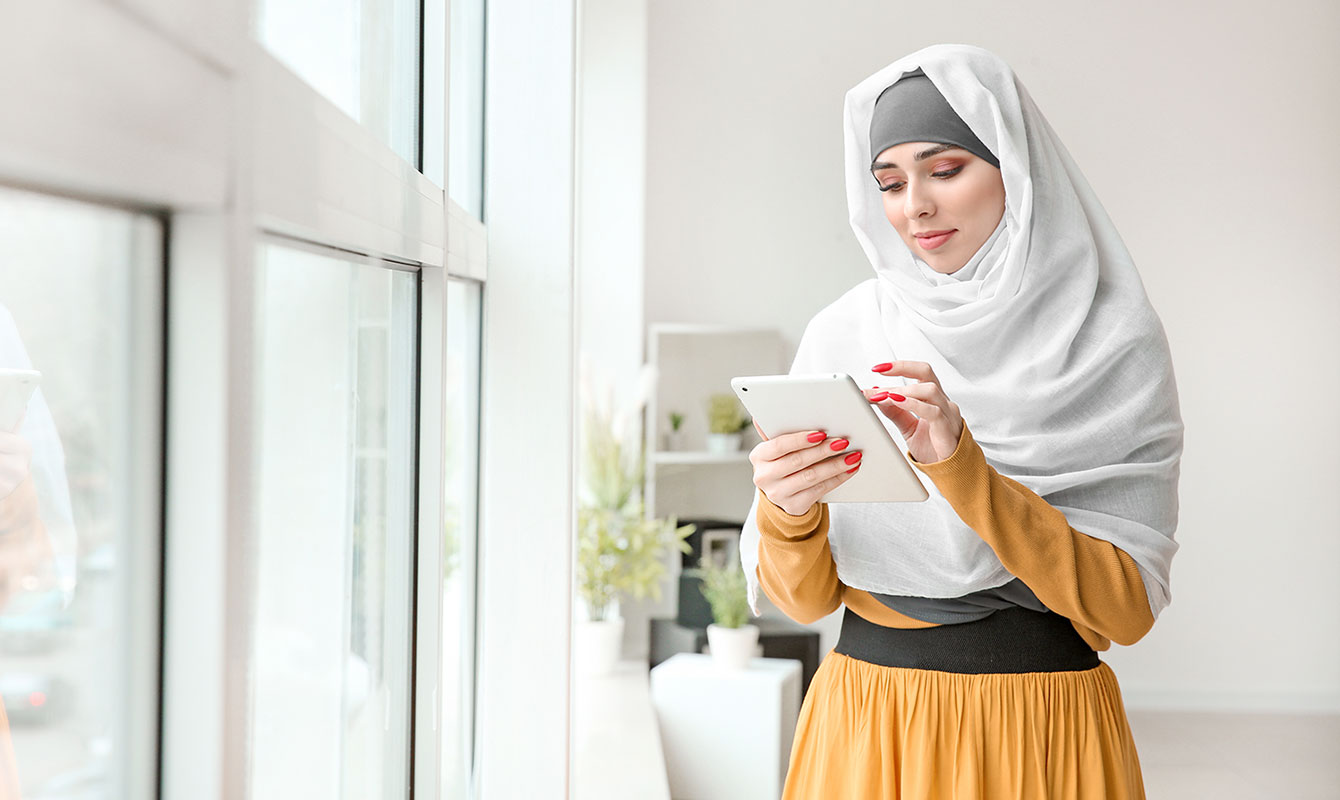 Young woman using her tablet